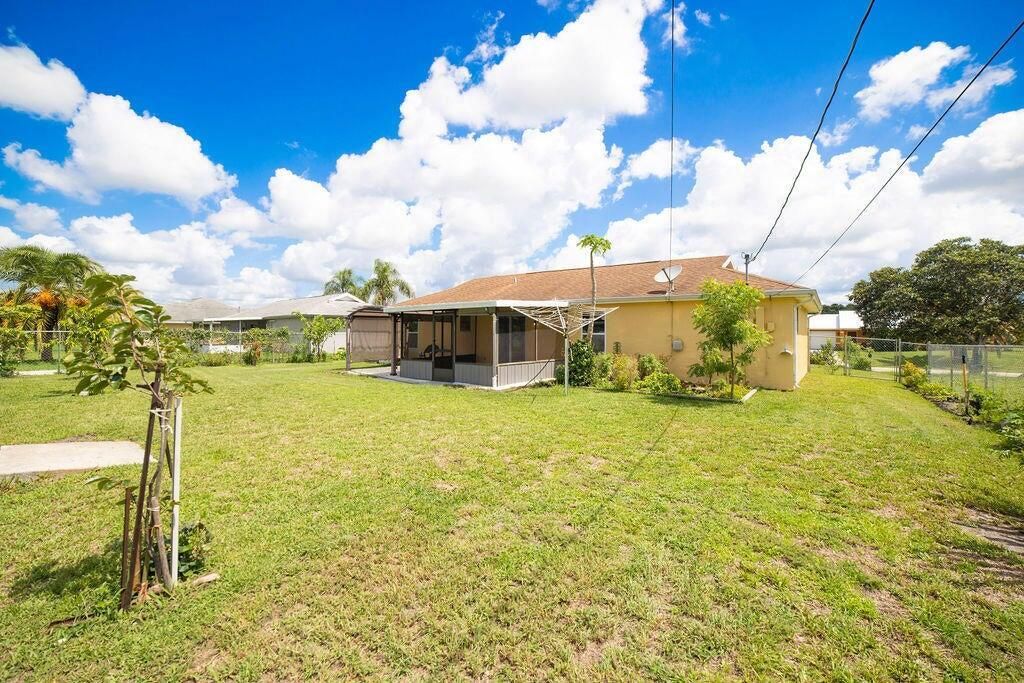 Photo of 612 SW Stillman Avenue, Port Saint Lucie, FL 34953 (MLS # R11103638)