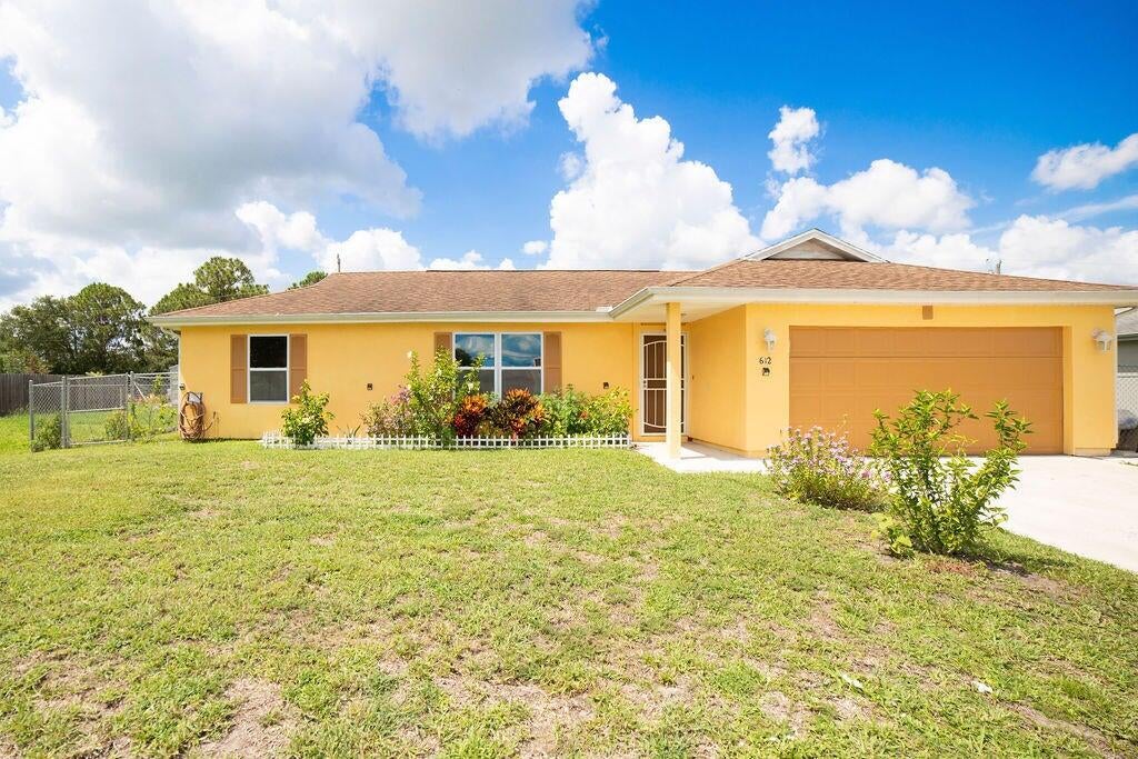 Photo of 612 SW Stillman Avenue, Port Saint Lucie, FL 34953 (MLS # R11103638)