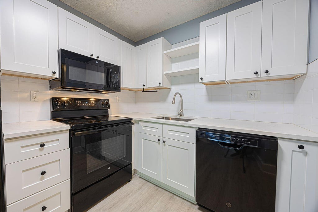 Photo of 9440 SW 8th Street #417, Boca Raton, FL 33428 (MLS # B26044194)