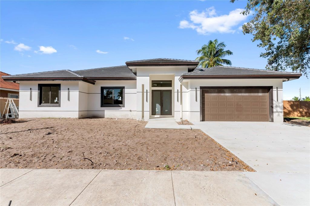 Photo of 621 NW 42nd Ave, Coconut Creek, FL 33066 (MLS # F10538349)