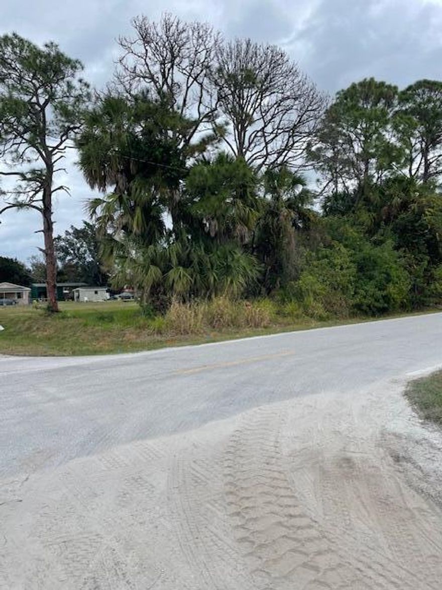 Corner lot, buildable, non conforming lot, needing county approval or variance. This lot does not meet dimension requirements
for current zoning, however it is a Nonconforming lot which may be buildable with allowable corner set backs (letter attached from St. Lucie Planning and Zoning. Buyer to confirm all building requirements,set backs, for build and septic system. Buyer to make application to county for septic system placement. Public water available. Buyer responsible to verify utilities,zoning restrictions, land clearing, etc. to facilitate desired use of property.