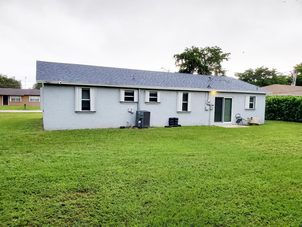 Photo of 1477 N Mangonia Drive, West Palm Beach, FL 33401 (MLS # R11135909)