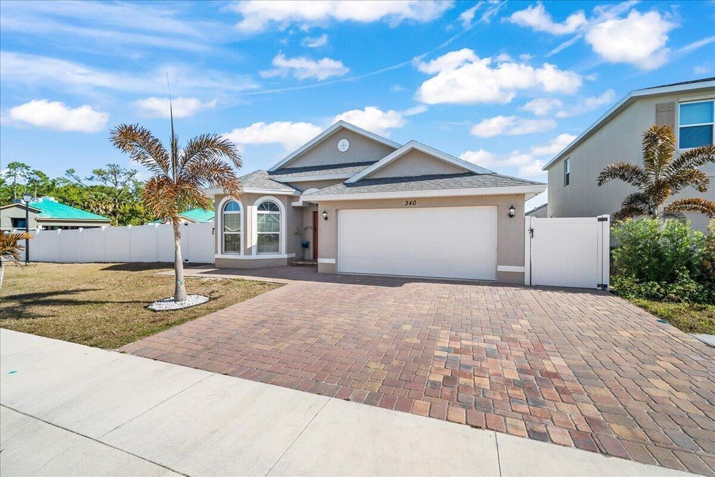 Photo of 340 PALM BREEZES Drive, Fort Pierce, FL 34945 (MLS # B26063882)