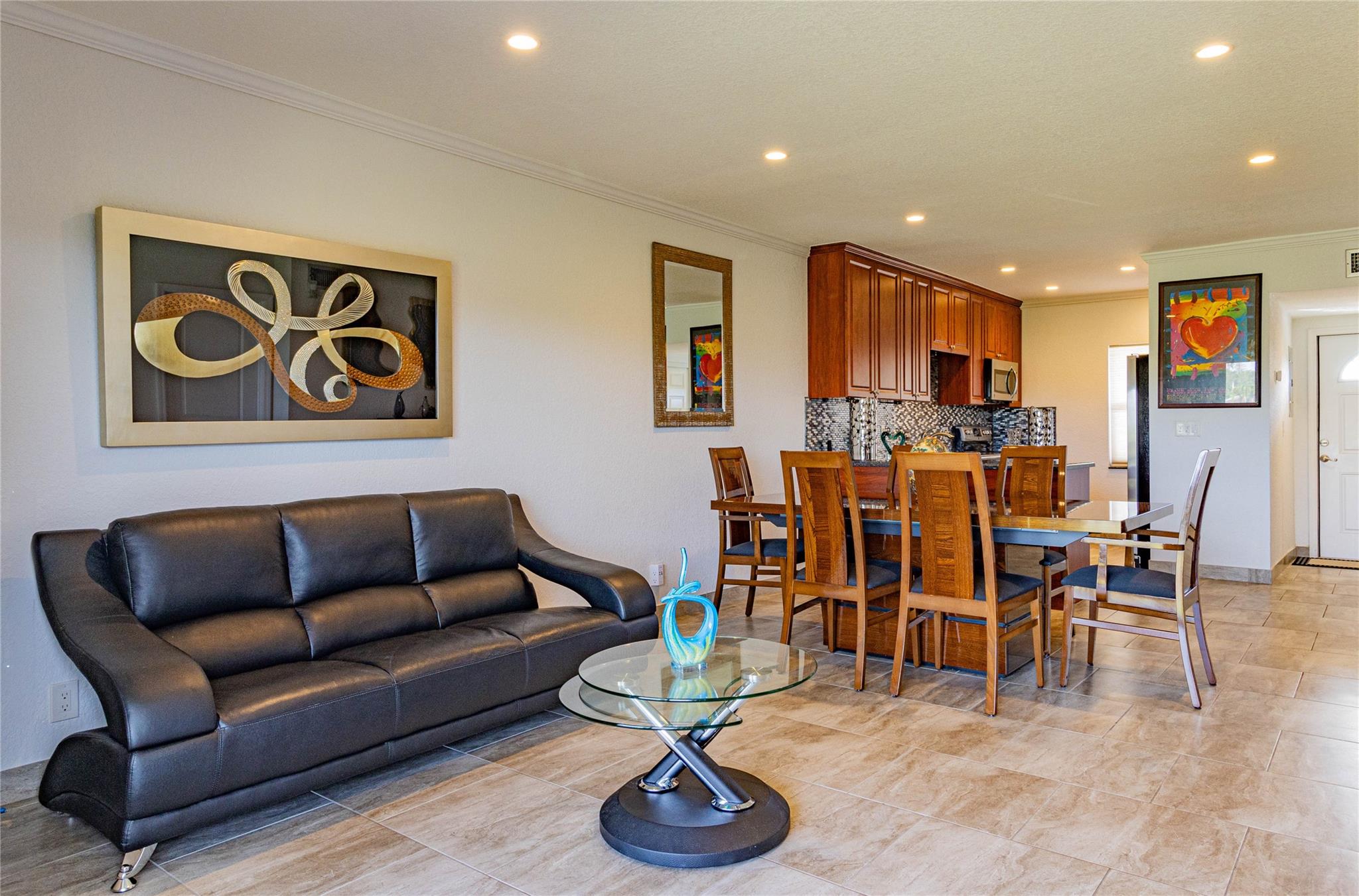 Beautifully Renovated Open Concept 2-Bed, 2-Bath Corner Condo with View – Priced to Sell!
Appraised & priced to sell, this bright & spacious 2nd-floor offers both value and style. Enjoy peace of mind with impact windows, new electrical, a tankless water heater, and a brand-new AC system all contributing to lower insurance costs. The living space is filled with natural light & features crown molding, recessed LED lighting, & a private tiled balcony. The kitchen is boasting custom cherry wood cabinetry, a large food pantry, Blue Pearl granite countertops, & brand-new stainless steel appliances. The primary suite features a walk-in custom closet and a fully updated bathroom. The guest suite is equally impressive with its own remodeled bathroom & walk-in shower.