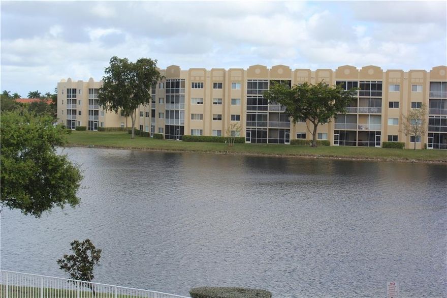 REDUCED!! VACANT AND SANITIZED!!! HUGE RARE 1865 sq ft 2/2 unit w/additional oversize DEN that can convert to a 3rd bedroom. Desirable GRANVILLE unit -Water views from almost every room! This PRINCE model has both a large screened front porch & a wrap around screened back patio. Very large breakfast area right off the kitchen PLUS  formal living/dining area. Great split plan w/the Den/Guest/Bedroom off the kitchen and the other bedrooms overlooking the lake. NEW high efficiency washer/ryer IN large laundry room. WALK IN closets! SIZABLE master suite with double vanity, big walk in closets plus additional closet, separate toilet/shower in bathroom. Patio tiled w/plexiglass and accordian shutters. Work desk in kitchen. KINGS POINT has over 200 clubs, free shuttle, 1000 seat theater.