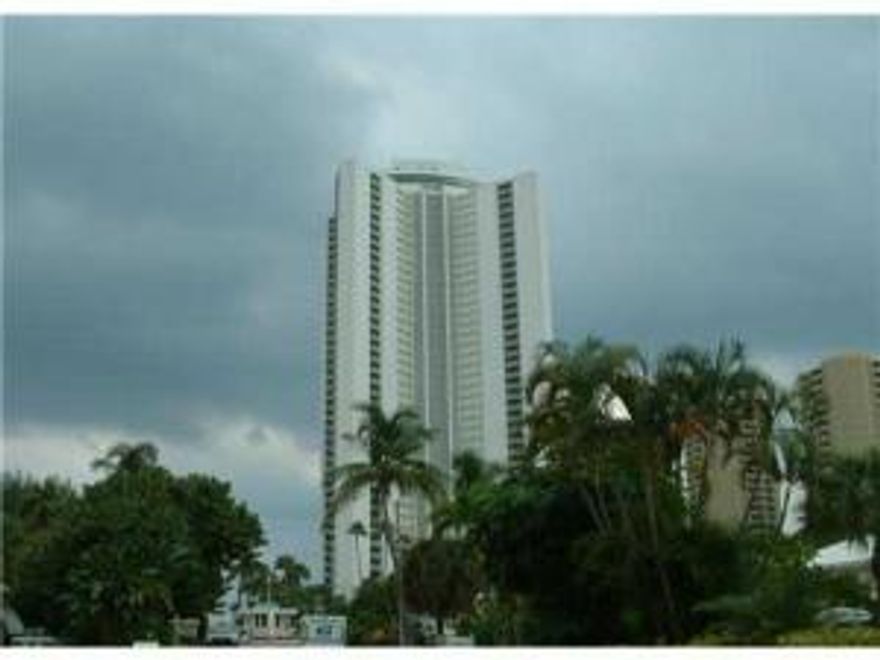 Unfurnished 1 bedroom unit.  Tiled flooring throughout.  Stack Washer/dryer. View of beach, ocean, and intracoastal.