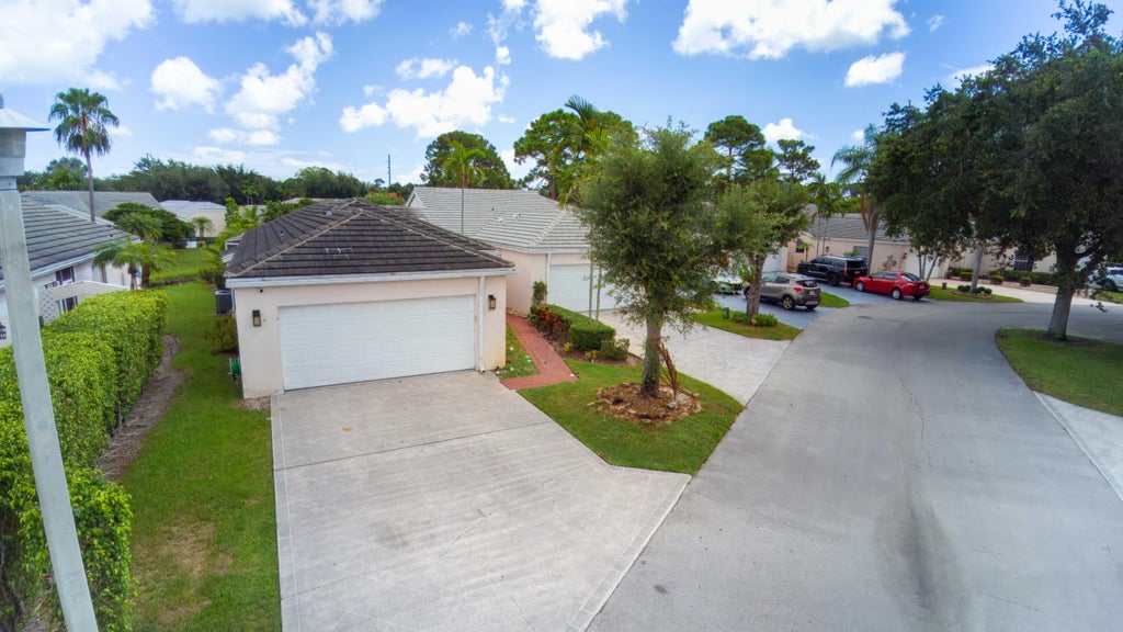Photo of 1066 Island Manor Drive, Greenacres, FL 33413 (MLS # B26071036)