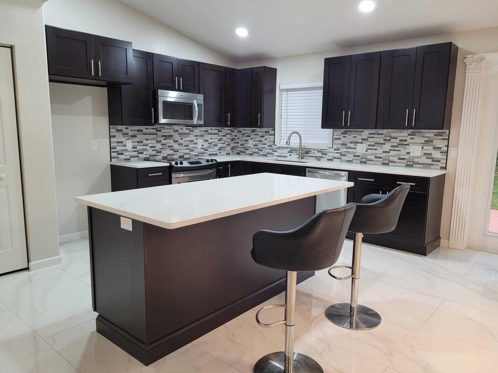 Photo of 7605 Woodland Creek Lane, Lake Worth, FL 33467 (MLS # R10998936)