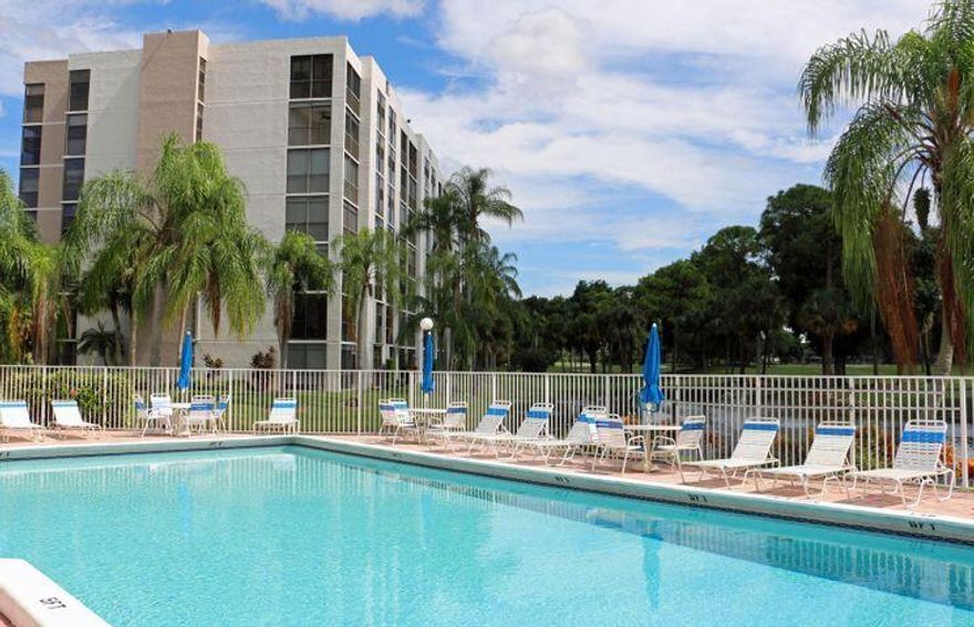 BEAUTIFUL CORNER UNIT WITH EAST EXPOSURE, LAKE, GOLF COURSE, AND POOL VIEWS. COMPLETELY BEAUTIFULLY REMODELED. Clubhouse and lobbies being redone. This first floor Condo makes you feel you are in your own house. Excellent Location! EVERY ROOM has picturesque views of LAKE, GOLF & POOL and South East tropical breeze continually blowing. Move right into this spacious 1st floor condominium. Completely remodeled Newer Appliances, Closets, Complete set of Hurricane shutters .ADDITIONAL WORK ON BUILDING will be done this Summer.
Patio has been enclosed with hurricane doors, adding to the sq Ft of the condo.