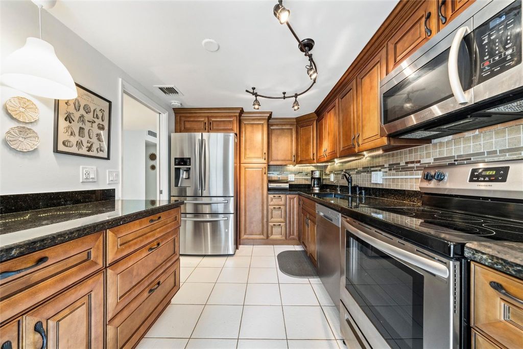 Photo of 3150 N Course Lane #204, Pompano Beach, FL 33069 (MLS # F10525126)