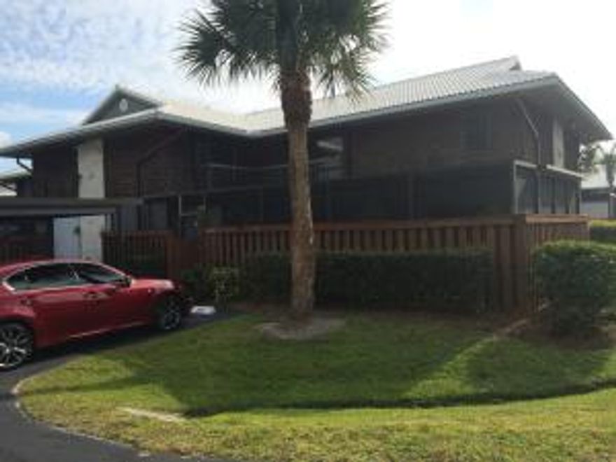 Centrally located Camelot Gardens! Completely remodeled kitchen and baths, including the half bath. Walk out to the over sized patio from the kitchen, living room or first floor bedroom.  This home is very unique due to the kitchen upgrade.  You won't be disappointed!!!!  Centrally located, close to shopping, restaurants and the beach.