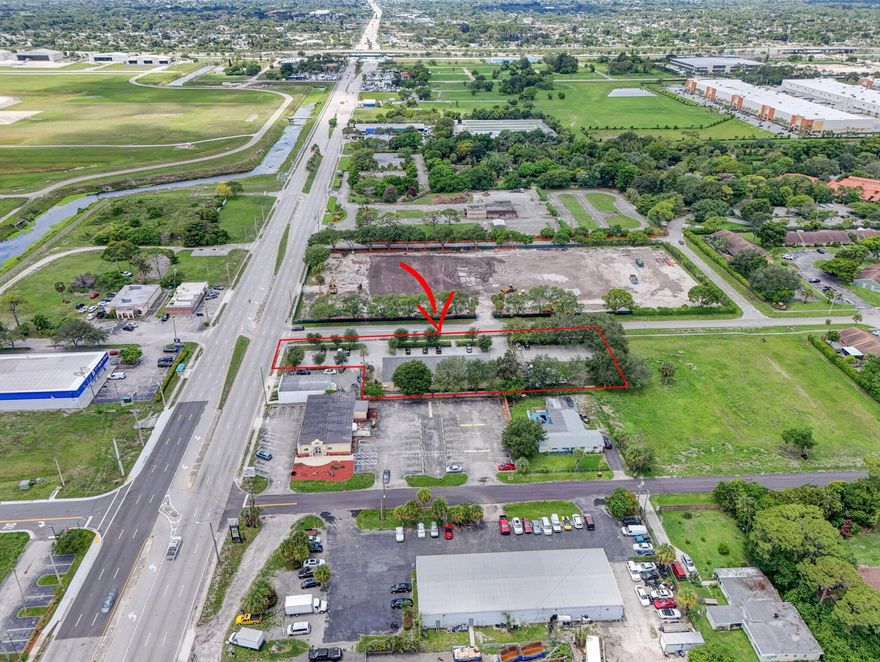 Outstanding opportunity to own a fully upgraded 6,000+/- SF freestanding commercial building on 1.02 acres with excellent visibility on high-traffic Military Trail (+/-50,000 vehicles/day). The property features over $300,000 in recent interior improvements, a brand-new roof, sound-insulated ceiling, and four new 4-ton Rheem AC units. Interior layout includes a full bar setup, reception area, conference space, and up to 10 potential private offices, offering ideal flexibility for professional, creative, or flex-space users. Monument signage and ample parking. Prime location with easy access to I-95, Palm Beach International Airport, and major commercial corridors. Tesla recently acquired the neighboring parcel for $6.3M, further enhancing long-term area value.