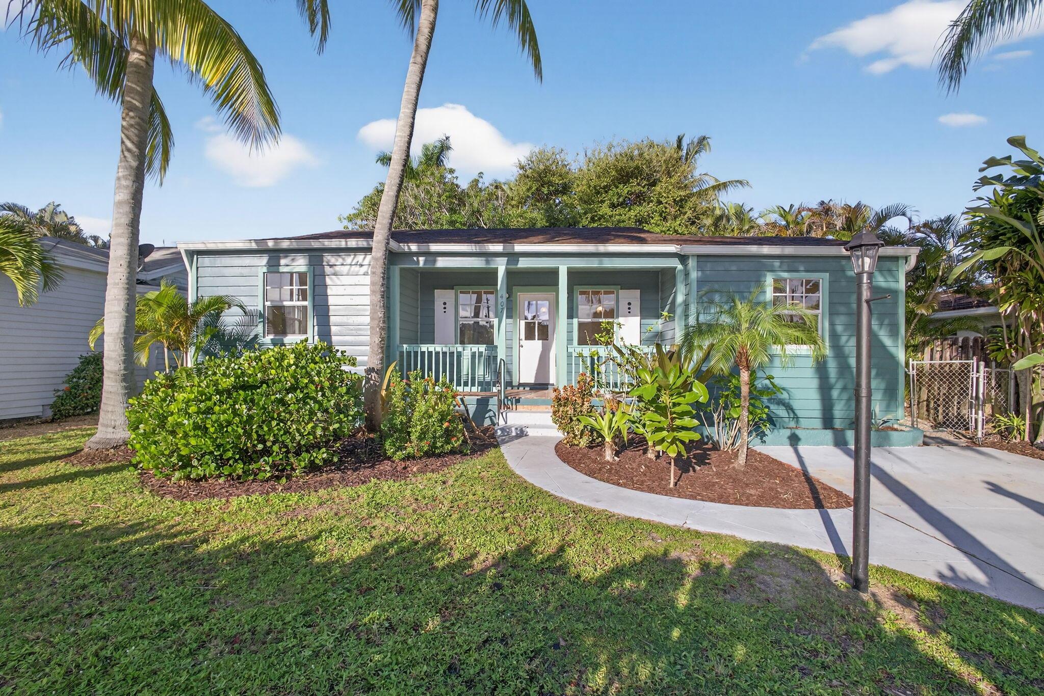 This is your opportunity to own a piece of Lake Worth Beach's rich history. This 3 bedroom, 2 bath cottage with a split floor plan has been completely renovated top to bottom, all with permits. Just move in and enjoy! No detail has been overlooked in this exceptional fresh and modern renovation.  Its location is prized - only one block from the Intracoastal and Bryant Park waterfront, 3 blocks from town and a half mile from the beach.  All impact windows and doors. The ceiling in the living room has been opened up to create a vaulted ceiling with open beams. Custom built-in shelves anchor the living room.  The custom chef's kitchen with open shelving features a gas range. Gorgeous original wood floors have been preserved and refinished. The primary bedroom wing has a spacious