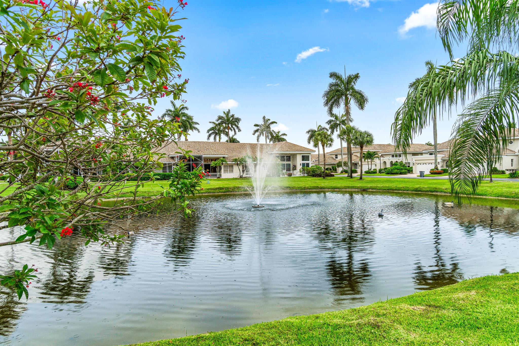 Nestled in an ideal location within The Polo Club, and within close walking distance to the clubhouse, this one-level home offers brand-new upgrades that include a complete refresh, as well as all-new impact windows, doors, and blinds throughout. Overlooking a tranquil pond with a soothing lit fountain, relax and unwind on your private patio to take in the sunset views. Upon entering, soaring ceilings flow effortlessly into the dining area and living room, creating an inviting gathering space. The adjacent eat-in kitchen offers functionality and views while dining. The sun-filled, spacious primary bedroom features a walk-in closet, dual sinks, and a generously sized bathroom. Two additional bedrooms provide space for family and guests, with one offering a sleeper queen sofa. This home