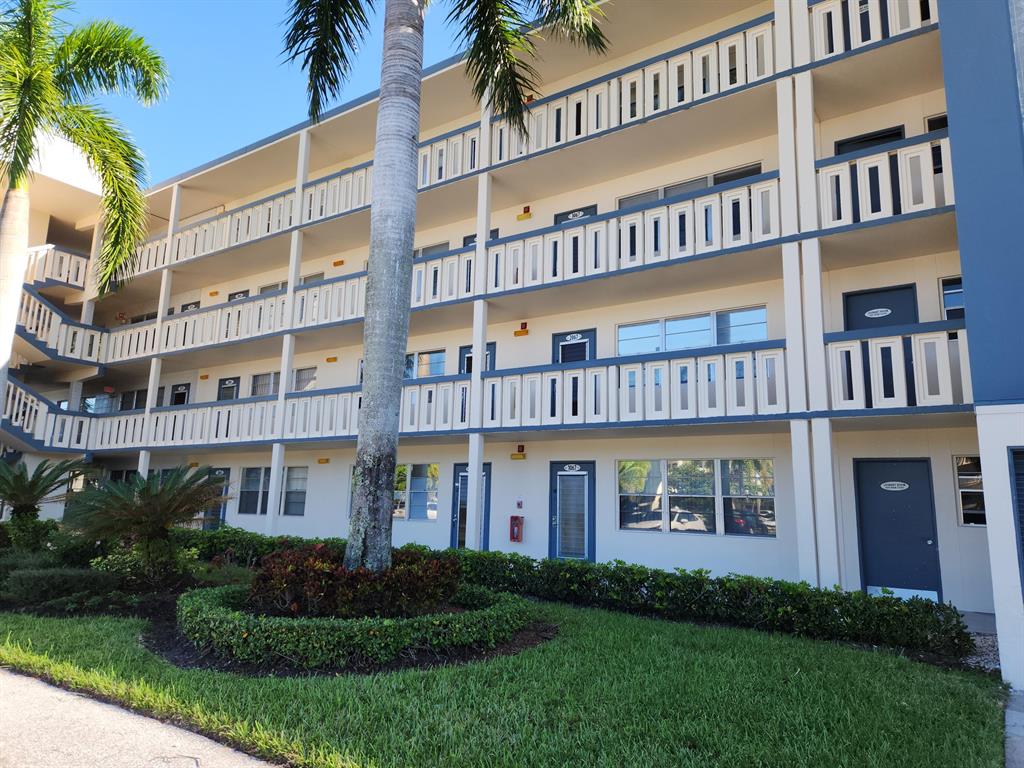 BACK ON THE MARKET...rare 1st floor unit. Bright & Sunny first floor unit with beautiful lake views. Enclosed Florida room. Newer luxury carpet in bedroom. Laundry room next door. Parking spot is steps from the unit. Fabulous community clubhouse with newly renovated professional theater, state of the art fitness center, plus indoor pool and outdoor pool, Each village has it's own pool as well.Walking distance to clubhouse and houses of worship. Don't drive? No problem, buses in front of your building to clubhouse and then buses to take you all over to shopping, etc.