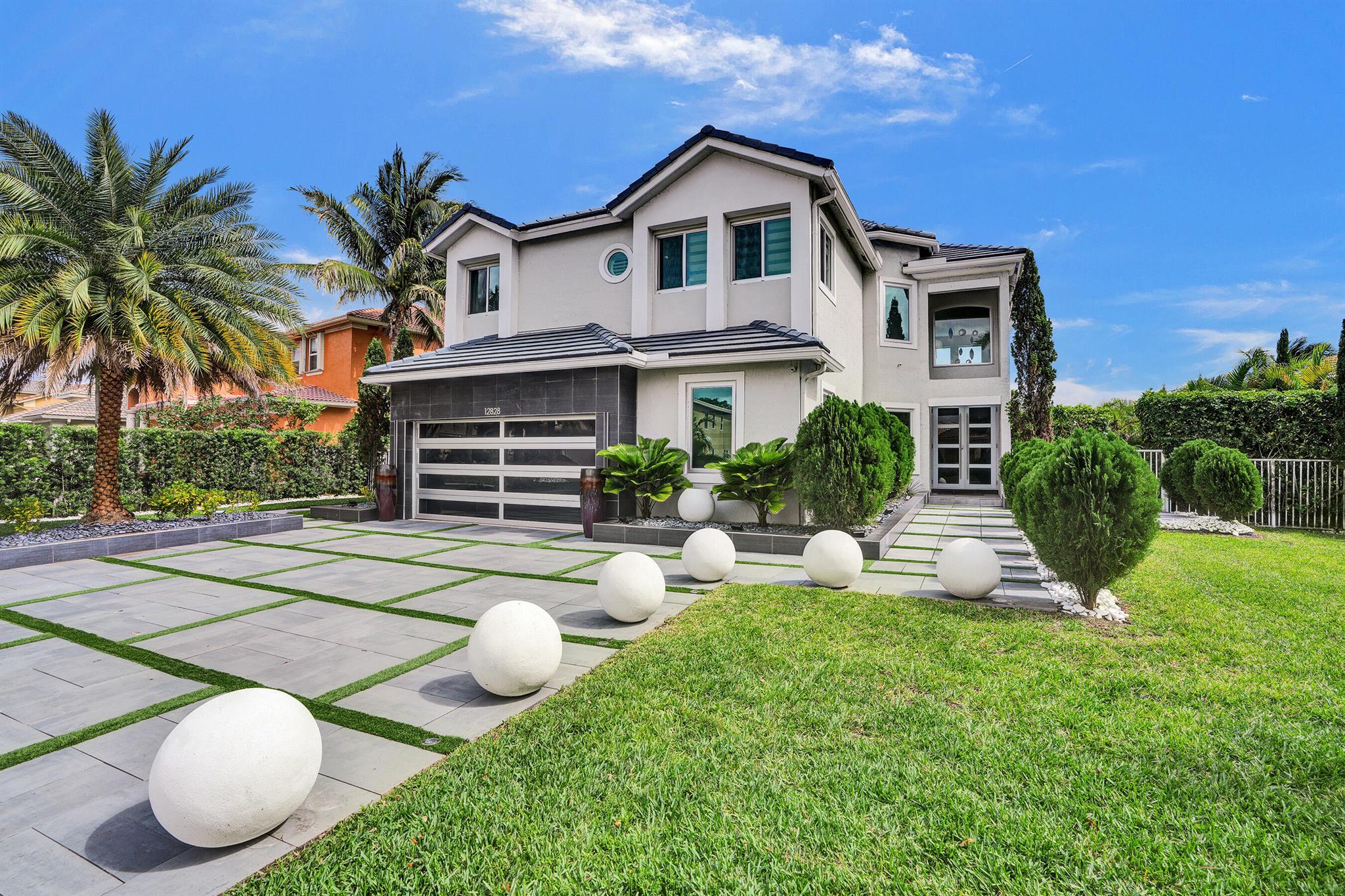 Welcome to one of the largest and most impressive models in the desirable Portofino North community! This stunning 6-bedroom, 3-bathroom residence offers a generous 3,158 square feet of fully renovated living space, thoughtfully designed with a sleek modern aesthetic and an open floor plan. Step into the heart of the home with a beautifully updated kitchen featuring stainless steel appliances, elegant quartz countertops, and abundance of cabinet storage. The spacious master suite provides a serene retreat, complete with a luxurious en-suite bathroom. Perfect for both relaxing and entertaining the outdoor space includes a heated pool w/spa. Top of the line outdoor kitchen overlooking the calming presence of a lake. Don't miss out on the opportunity to make this your dream home!