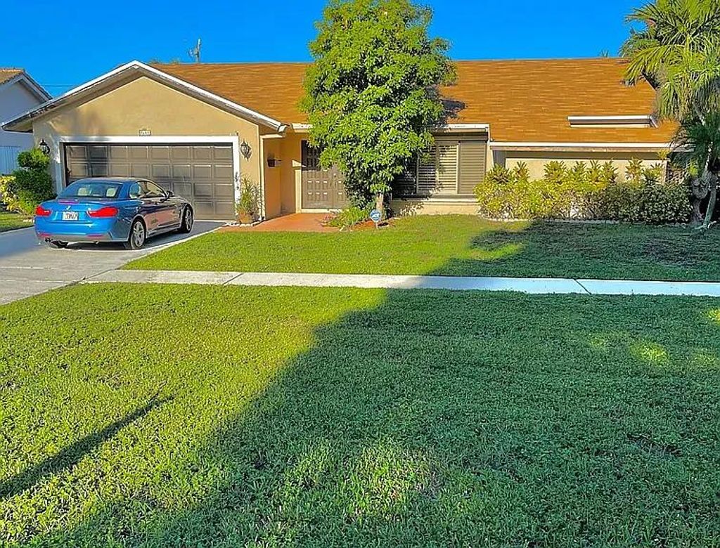 Photo of 7689 W Country Club Boulevard, Boca Raton, FL 33487 (MLS # R11115581)