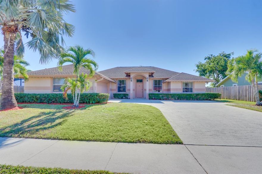 Wow!  A 4 bedroom home with SOLAR POWER and NO HOA in Wellington for UNDER 400K?  Come quickly before this one is GONE!  Imagine having electric bills of less than $100/mo!  This could be your bill if you buy this great property.  The well maintained home also features a 1/4 acre of land with a fenced back yard and a canal fed sprinkler.  Inside you'll find 4 bedrooms with a three way split (GREAT for guests), tile throughout, 42'' maple cabinets,french doors, a roman tub in the master bathroom, LOTS of room in the 2 1/2 car garage for all the toys- in short, just about everything you could ask for at a great price.  Located in the city of Wellington, you will have access to all the parks, amenities, and shopping that this great city offers.  CALL TODAY!!