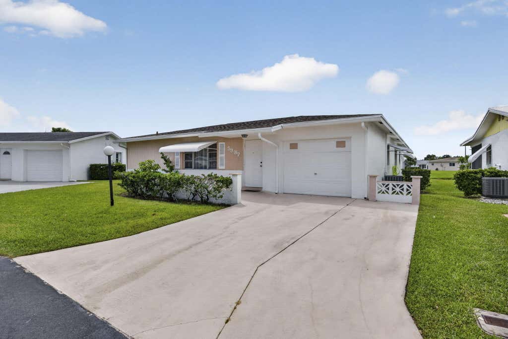 Photo of 5337 BELLEVILLE Road, West Palm Beach, FL 33417 (MLS # B26053502)