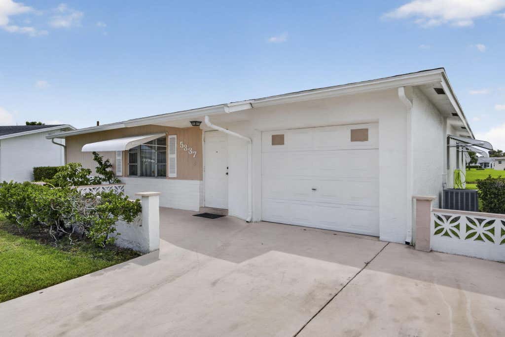 Photo of 5337 BELLEVILLE Road, West Palm Beach, FL 33417 (MLS # B26053502)
