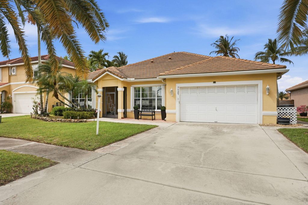 Photo of 7121 Catalina Isle Drive, Lake Worth, FL 33467 (MLS # B26003632)