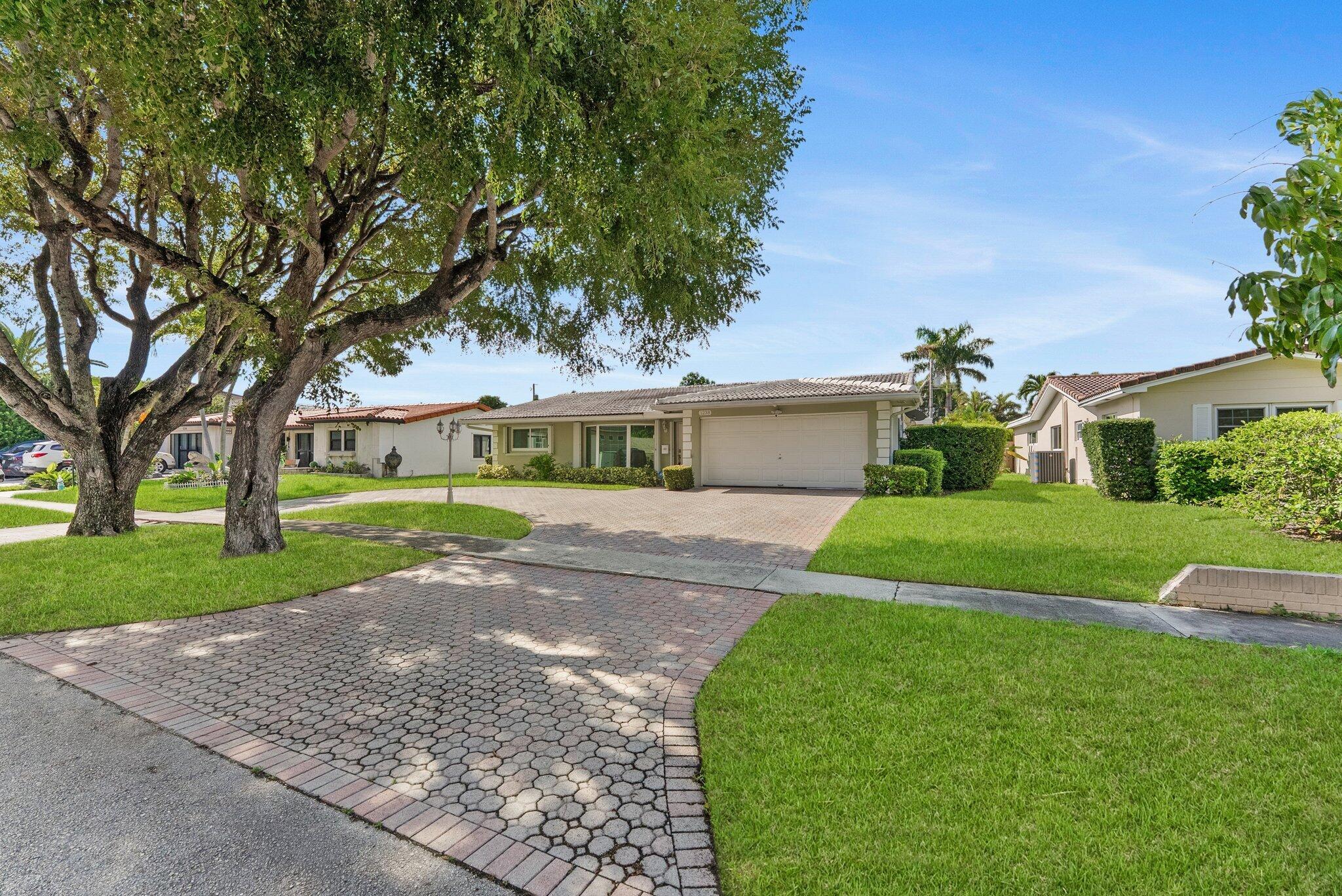 Discover this exceptional 6-bedroom, 4-bath residence with a den and spacious 2-car garage, complete with a wall A/C unit for flexible comfort. Two fully permitted bedrooms provide ideal options for guests, office, or multi-generational living. Major updates ensure peace of mind: impact windows (2018), sliding doors (2019), two new A/C units (2023), water heater (2023), updated sewer line to main, and roof improvements with acrylic/elastomeric coatings. Outdoor living features a screened lanai and paver driveway. With no HOA restrictions, this property delivers true freedom to create the lifestyle you envision!