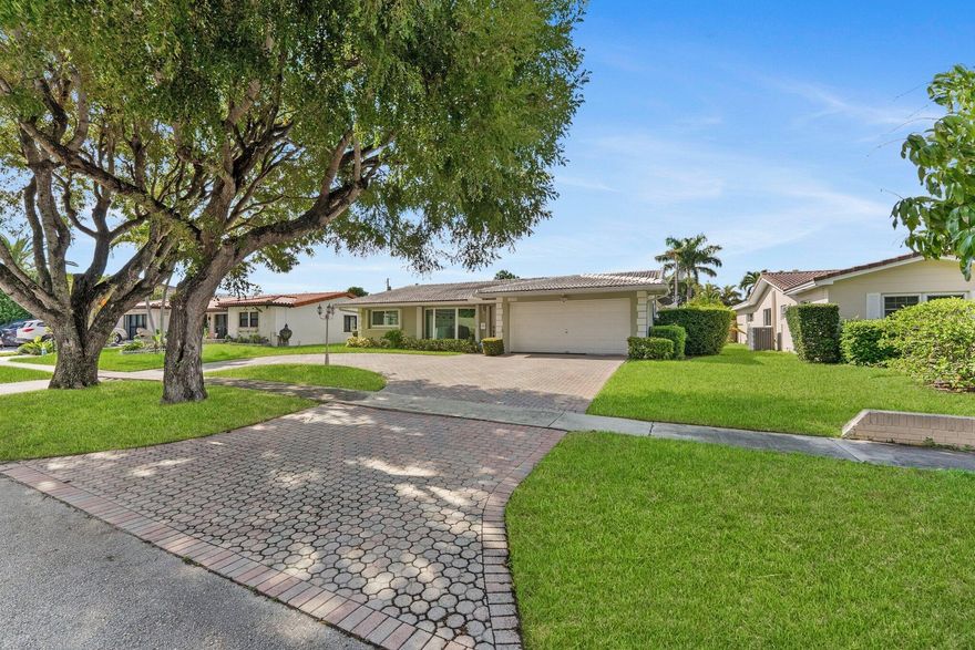 Discover this exceptional 6-bedroom, 4-bath residence with a den and spacious 2-car garage, complete with a wall A/C unit for flexible comfort. Two fully permitted bedrooms provide ideal options for guests, office, or multi-generational living. Major updates ensure peace of mind: impact windows (2018), sliding doors (2019), two new A/C units (2023), water heater (2023), updated sewer line to main, and roof improvements with acrylic/elastomeric coatings. Outdoor living features a screened lanai and paver driveway. With no HOA restrictions, this property delivers true freedom to create the lifestyle you envision!