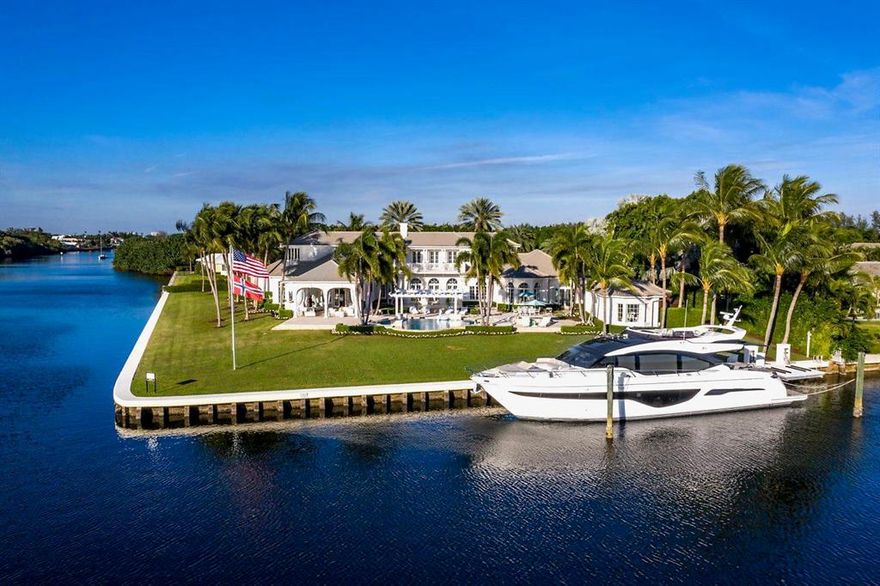 One of Gulf Stream's most desirable addresses, commanding a southern point lot view from nearly every room this Hamptonesque waterfront estate, designed by Randall Stofft, is situated on a rare one acre plus lot, encompassing over 470' of frontage and embracing the tenants of coastal living at its best.  With a warm feeling of belonging and a gracious layout with panoramic water views the estate is comfortably spacious with 6 en suite bedrooms, 7 full baths, first floor master, epicurean kitchen with informal dining surrounded by water, sun filled family room, State of the Art Home theatre, formal dining room, dual offices, exercise room, massage room, loft area, guest house, five star resort pool, entertaining loggia with outdoor kitchen, 3 bay garage and a yachtsman's dock, all seamlessl seamlessl