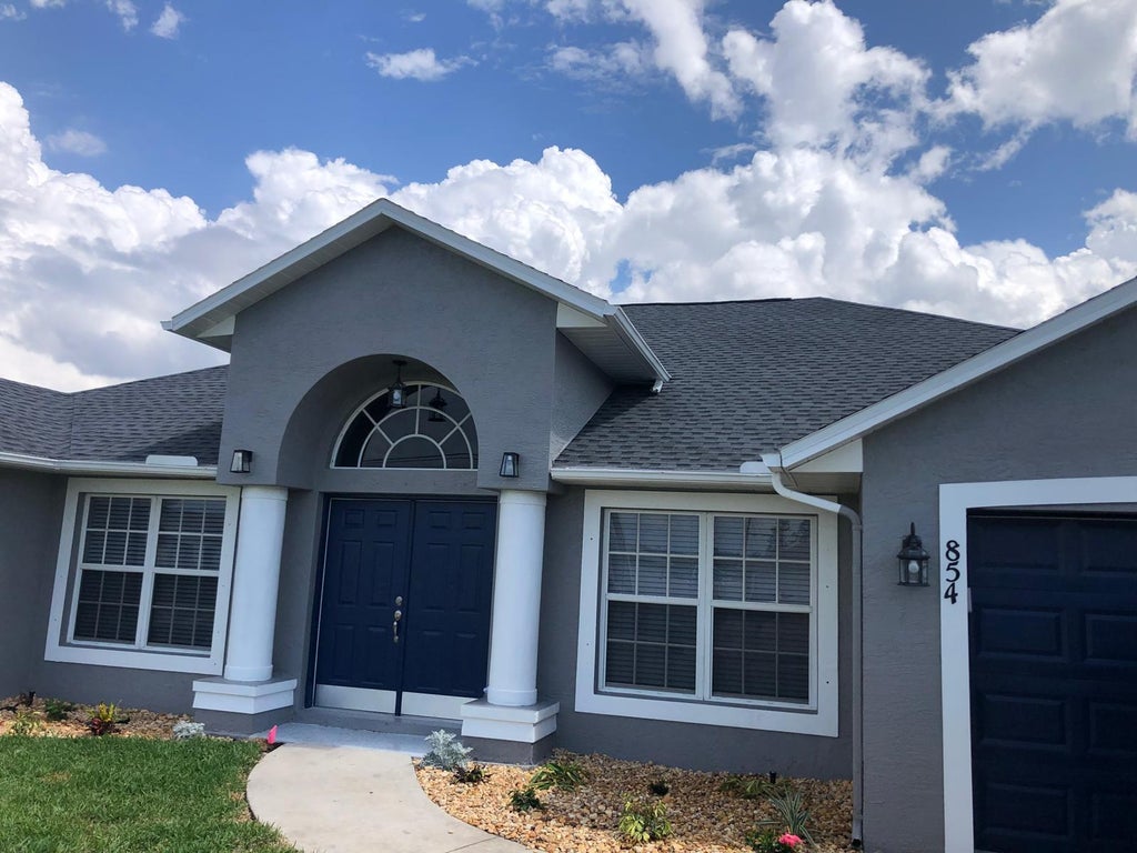 Photo of 854 SW PAAR Drive, Port Saint Lucie, FL 34953 (MLS # B26081591)