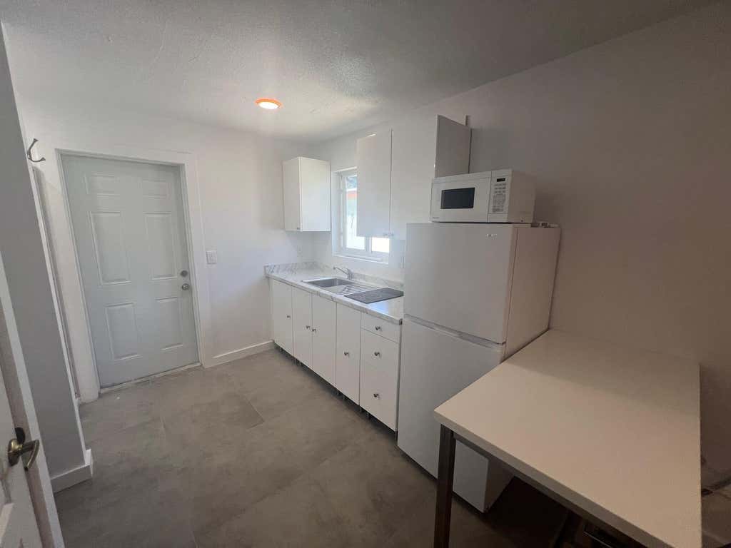 Photo of 1244 W 27TH Street #B, Riviera Beach, FL 33404 (MLS # B26056942)