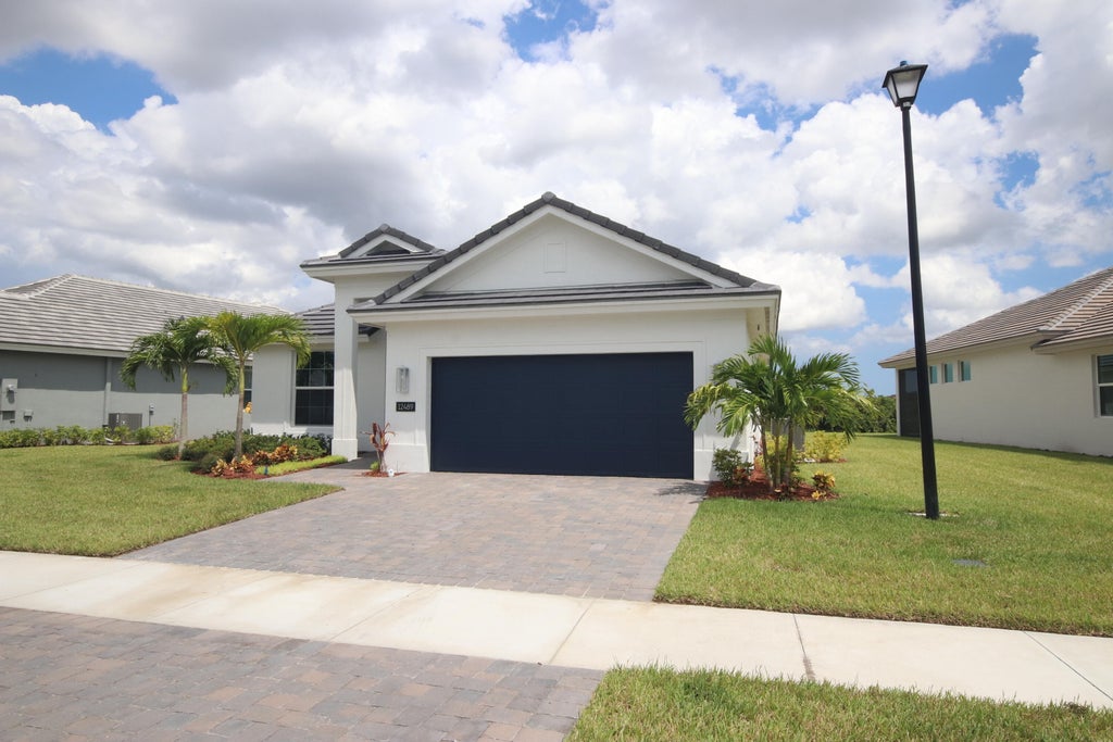 Photo of 12489 SW Sunrise Lake Terrace, Port Saint Lucie, FL 34987 (MLS # R10919921)