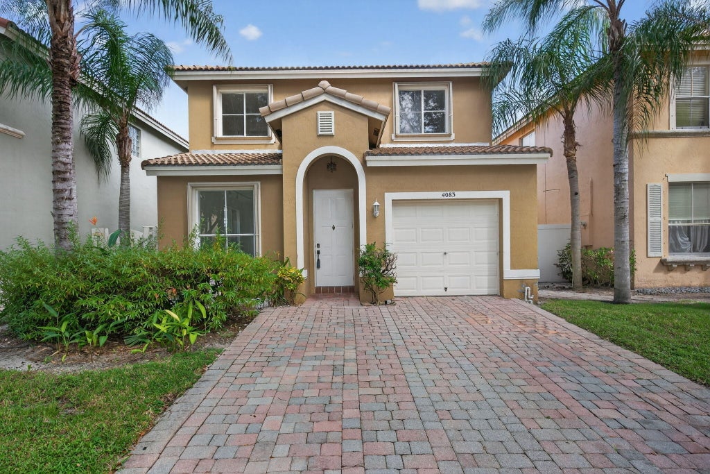 Photo of 4083 LAKE TAHOE Circle, West Palm Beach, FL 33409 (MLS # B26084529)