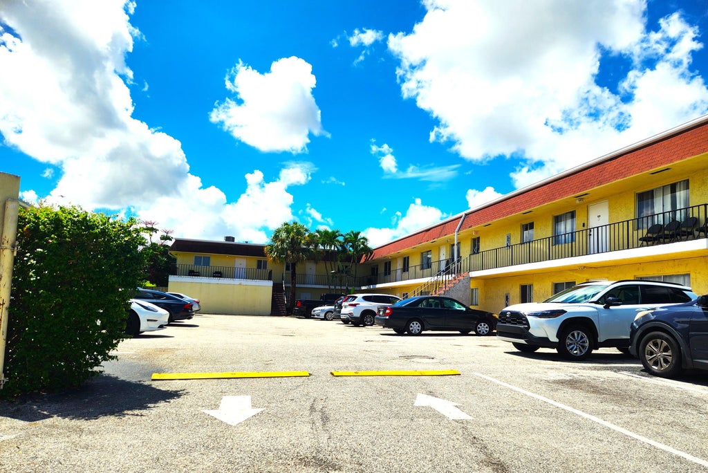 Photo of 1020 CRYSTAL LAKE Drive #103, Deerfield Beach, FL 33064 (MLS # B26073263)