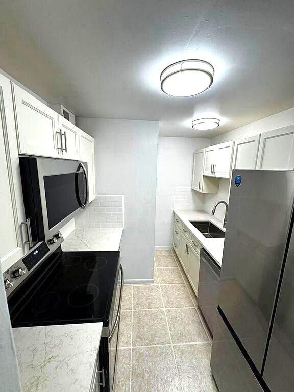 Photo of 1020 CRYSTAL LAKE Drive #103, Deerfield Beach, FL 33064 (MLS # B26073263)