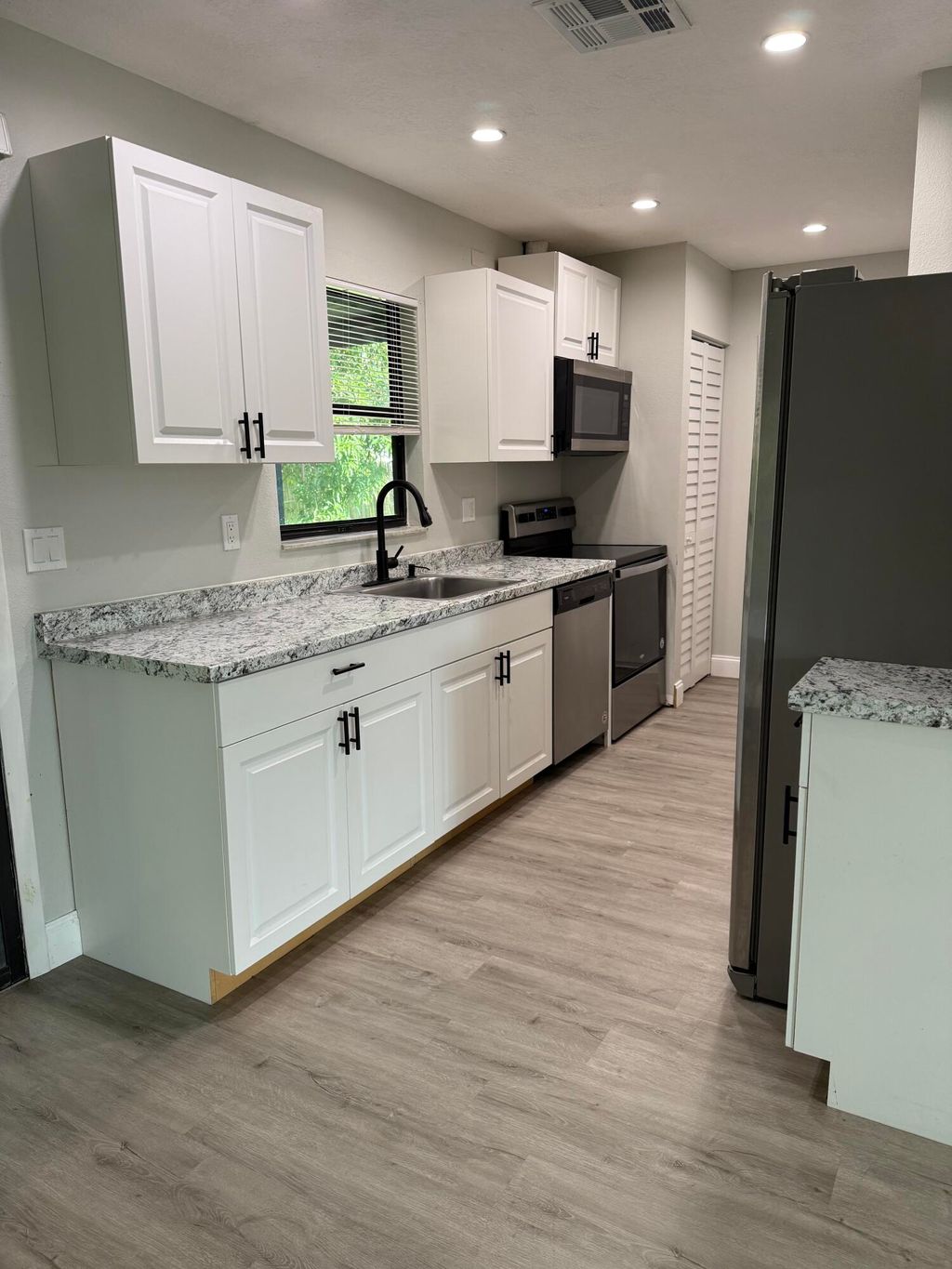 Photo of 1931 SW Beekman Street, Port Saint Lucie, FL 34953 (MLS # R11114436)