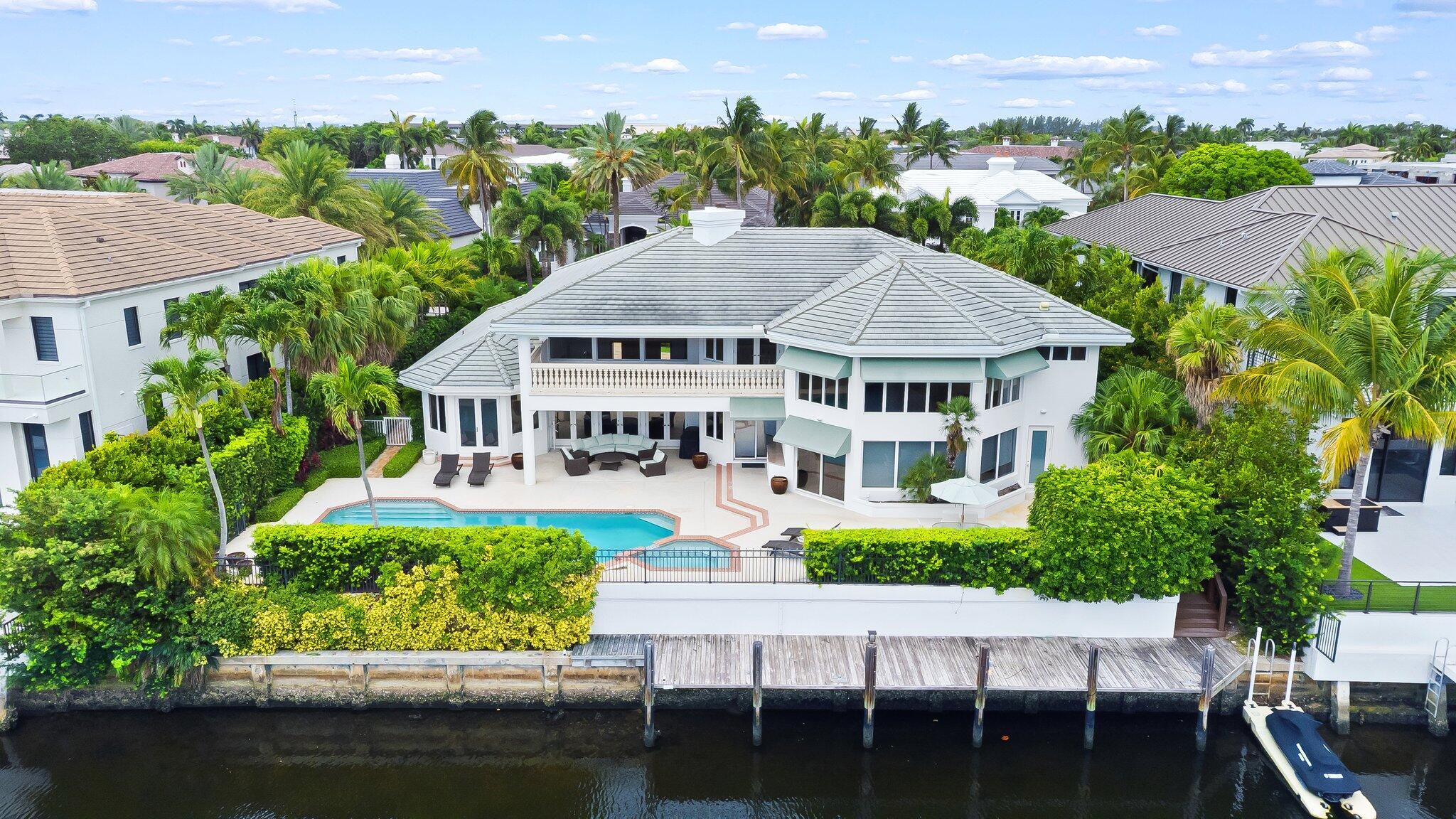 First Time on the Market - Annual Rental in Royal Palm Yacht & Country Club Welcome to 396 E Coconut Palm Road, a stunning waterfront estate available for lease in one of East Boca Raton's most prestigious communities--Royal Palm Yacht & Country Club. This designer-furnished & professionally decorated home offers 6,428 square feet of luxurious living space, Designed for both grand entertaining & relaxed everyday living. Featuring 115 feet of deepwater frontage with a dock, it's the perfect setting for yachting enthusiasts. Enjoy resort-style outdoor living with a sparkling pool & spa, multiple private patios, & a waterfront balcony. Inside, the open-concept floor plan features 6 spacious bedrooms, 7 full bathrooms, & a 3-car garage. Primary suite has 2 spa like bathrooms -see more info -->