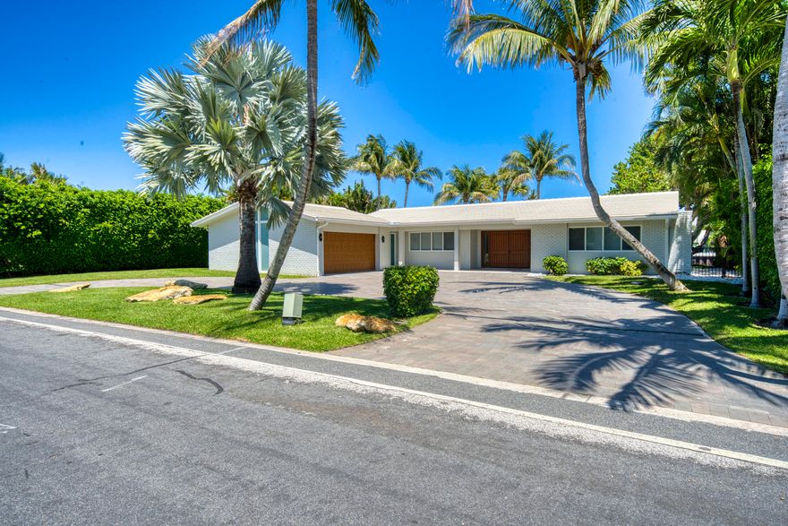 Ibis Isle  Rare Offering   Impeccably maintained and beautifully updated, this one-story contemporary 3-bedroom, 2-bath Intracoastal Waterway waterfront residence offers 100 feet of prime frontage, showcasing tranquil water views from the main living areas and primary suite.Nestled in the highly desirable Palm Beach community of Ibis Isle, this exceptional home is a true hidden gem. Thoughtfully curated upgrades include a fully renovated designer kitchen with premium appliances, elegantly updated spa-like bathrooms, impact glass throughout, including windows, doors, garage door, and front entry, a resurfaced pool, and finished pool deck, driveway, porch, and foyer flooring— creating a seamless blend of modern sophistication and effortless coastal living.... Ideally located just minutes from the beach, world-class golf, and premier tennis, this is a rare opportunity to own a meticulously updated Intracoastal Waterway home in Palm Beach. Perfect for entertaining or simply relaxing while enjoying the ultimate waterfront lifestyle. A must see.