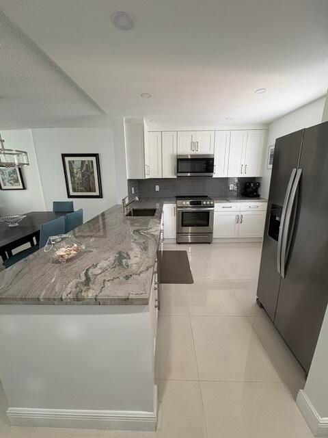 Photo of 424 SE 10th Street #203, Dania Beach, FL 33004 (MLS # B26024325)