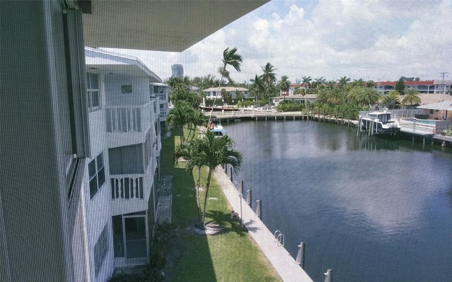 Reduced!! Rarely Available Top Floor Corner 2/2 With Spectacular Wrap-Around Water View On A Private Island! Live In Paradise In This Immaculate Spacious Unit.. Enjoy Breathtaking Sunsets On A Screened In Balcony.. Hurricane Shutters On Balcony & Windows. Ceiling Fans In Each Room..20" Lg Tile Throughout..Xtra Lg Sliding Door W/Tinted Glass..Beautifully Furnished Featuring Italian Leather Sofas, Brand New 65" TV & Sofa/Bed In Guest Room & Plenty Of Closet Space.. Breakfast Bar In Kitchen. Front Parking Spot Right Outside Door.. Additional Storage Unit..Bldg Has Reserves, New Roof & New Elevator. Heated Pool & Clubhouse. Best Location-Close To Beaches, Villages Of Gulfstream, Restaurants, Shopping, Margaritaville & More! 55+Bldg, Sm Pets OK..As-Is/Turn Key. Don't Miss This Great Deal!!