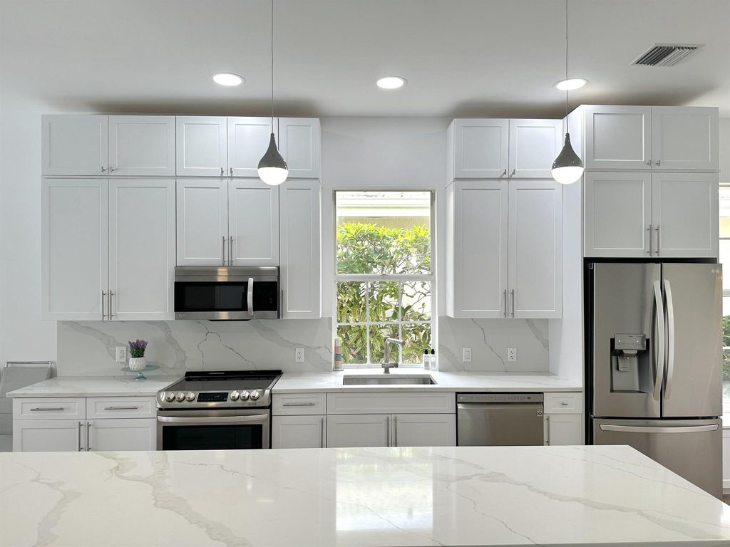 Photo of 1009 Bedford Avenue, Palm Beach Gardens, FL 33403 (MLS # R10922059)