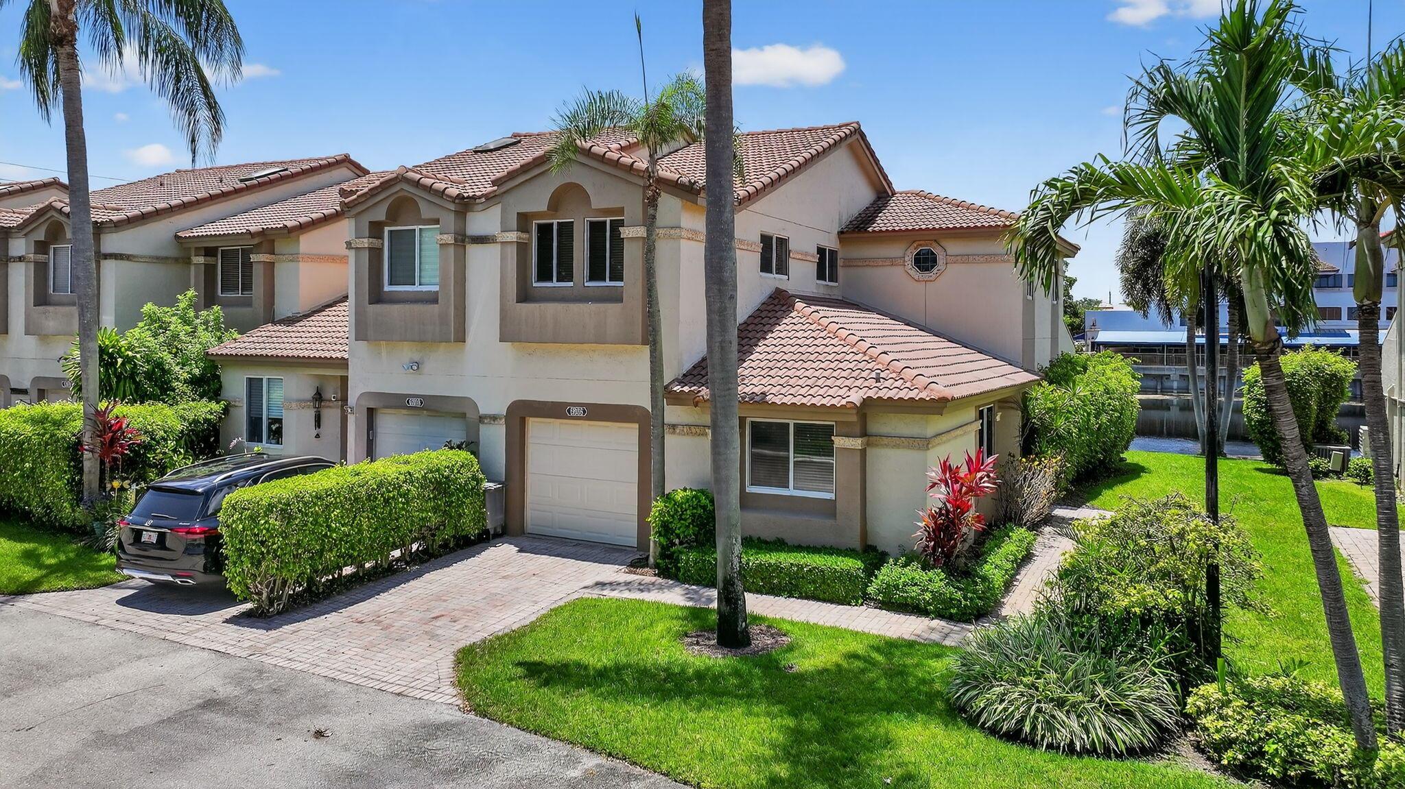 WATERFRONT LUXURY! Rarely available 3BR/3BA Corner Townhome w/garage on a Premium Lakefront lot in prestigious Cortina at Boca Pointe. Renovated with elegance and style--featuring an open-concept kitchen with custom quartz countertops, white shaker cabinetry, GE Cafe appliances, wonderful breakfast nook, impact windows throughout & an enclosed A/C lanai with sweeping water views. Designer-updated baths, new large-capacity W/D, Freshly epoxied garage floor. Immaculately maintained with a neutral palette to suit any decor. Select furnishings negotiable. Manned- gated community in prime central Boca near top schools, fine dining, shoppes, beaches, more! Walk to Community Pool. Sought after Boca Pointe offers an Optional club membership available. DON'T MISS! Schedule your Private Tour Today!