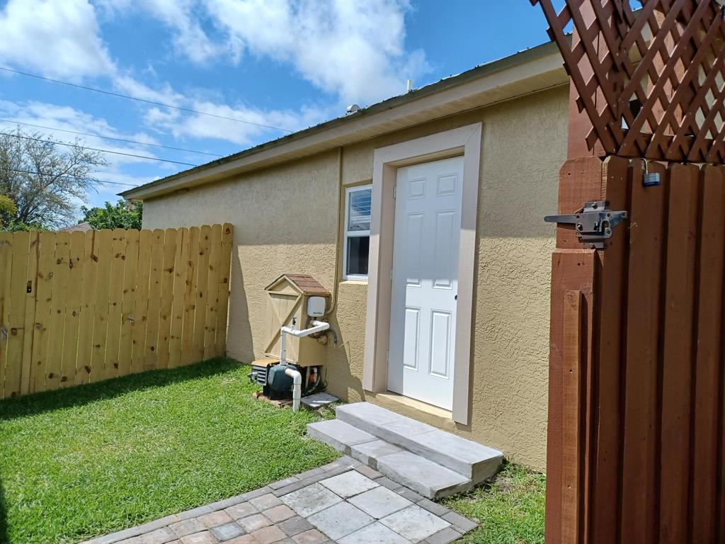 This one bedroom, one full bath, full kitchen apartment with new refrigerator range and microwave as well as a washer and dryer. Is Conveniently located nearTradition Medical Center, closed access to I-95 Shops and restaurants. Private gated independent entrance to apartment which is totally separated from main house for added privacy.All tile floors, no living area available.Outside main entry their is an area for a patio set for leisure time.