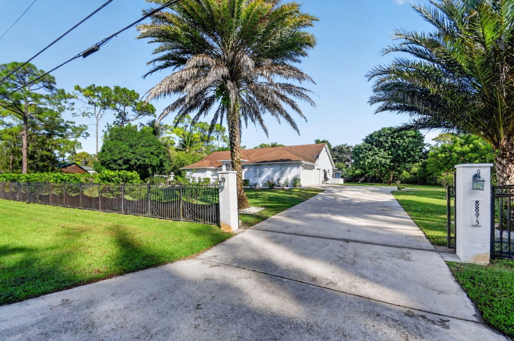 Photo of 8895 Palomino Drive, Lake Worth, FL 33467 (MLS # B26087524)