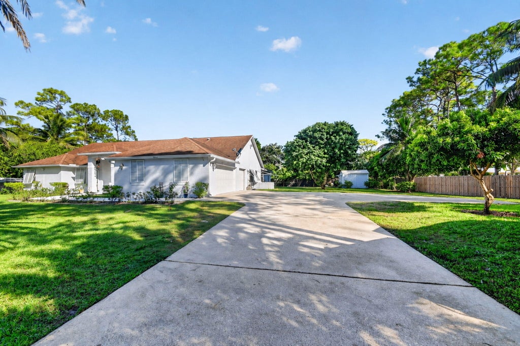 Photo of 8895 Palomino Drive, Lake Worth, FL 33467 (MLS # B26087524)