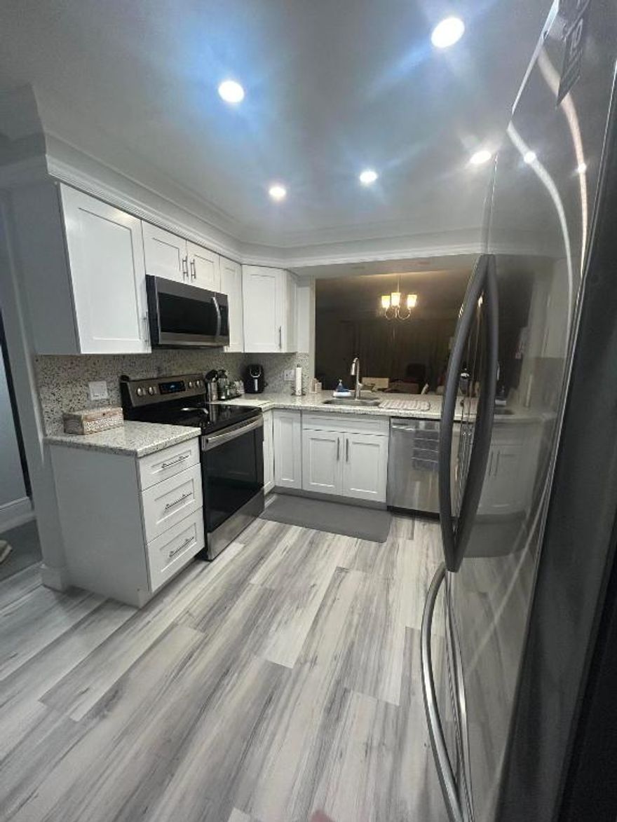 Motivated Seller!! Waterfront stunning 2 bedroom,2 bath waterfront condo fully furnished completely renovated condo  2nd floor.White kitchen self closing cabinets, Samsung Appliances, Quartz countertops & backsplash.Experience luxury living surrounded by serene water views.Waterproof 100% vinyl plank flooring thruout.  Living area flows into large screened balcony. Light & bright. Remodeled bathrooms w/ frameless shower doors & modern fixtures, granite counters. Master features 2 walk inc closets w/organizers - king bed Living room couch sleep. Main water turn off valve. Crown moulding.Property is TURN KEY All TV's & Furniture = Items EXCLUDED are Personal Items-Knick Knack, Master bedroom-2 end tables, Fabric bench, Orange fabric chair, Guest bedoom-table under mirror, beige fabric chai HOA 2026 -Includes reserve contribution 24/7 Manned Gate Security* Cable* Water* Reserve Funds* State of Art Updated Clubhouse* Mgmt Fees & Manager* Roof Maintenance, Assessment Paid Building Inspections completed 3/30/2025. No security concerns were noted! 
Property is sold "AS IS" with Right to Inspect. Please use current FAR/BAR AS IS contract. CASH Buyers must provide Proof of Funds - Financing Buyers must provide Proof of Funds & Pre-Approval Letter from Verified Lender. All sizes are approximate. INFORMATION IS HEREIN DEE,ED RELIABLE BUT NOT GUARANTEED