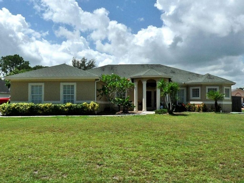 Photo of 2627 SW Ann Arbor Road, Port St Lucie, FL 34953 (MLS # R10911817)