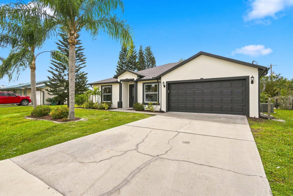 Photo of 820 SW Jennifer Terrace, Port Saint Lucie, FL 34953 (MLS # B26072947)