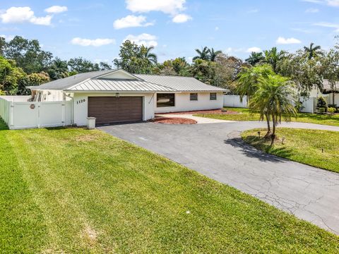 Photo of 1120 E Tropical Way, Plantation, FL 33317 (MLS # B26009485)