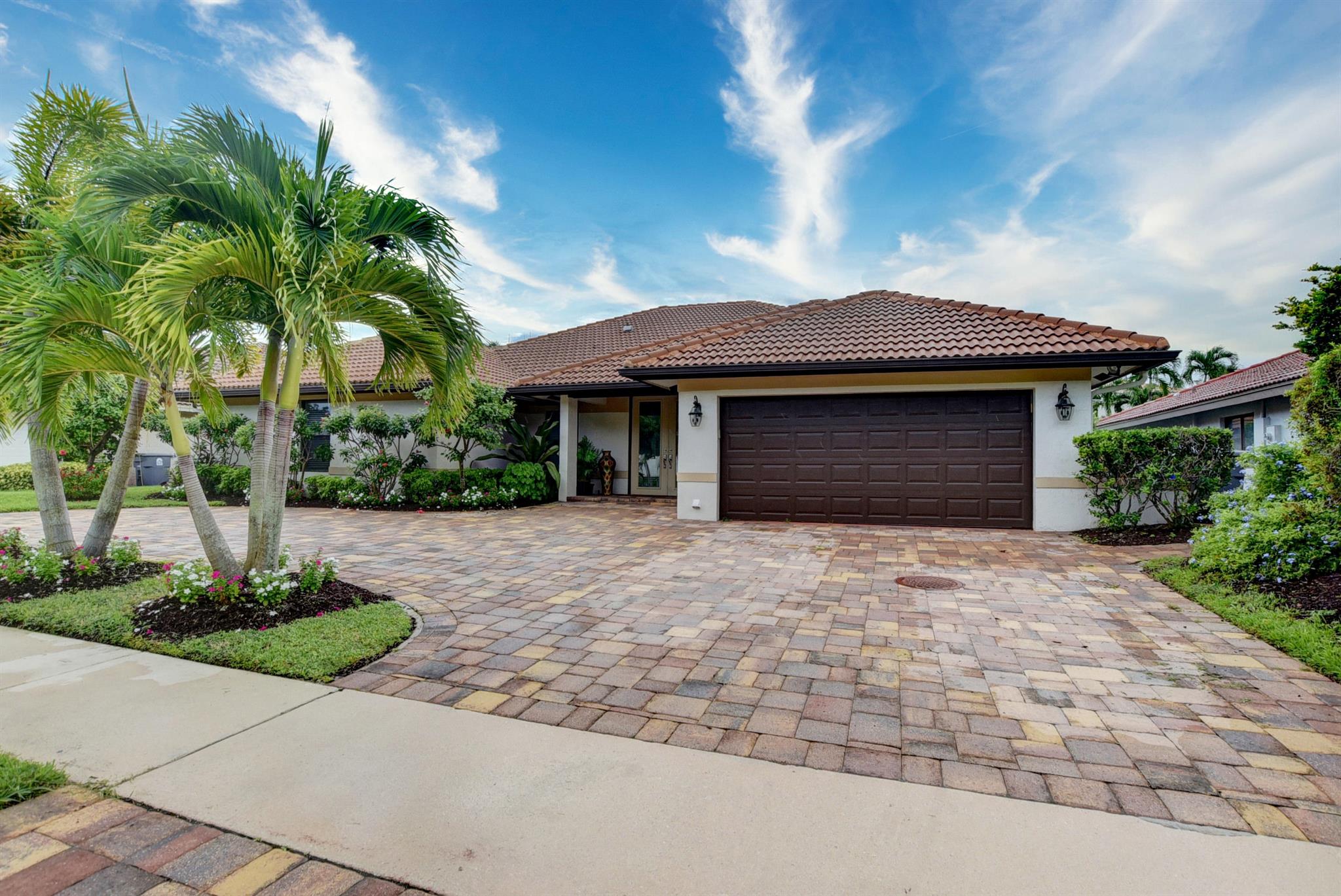 Stunning 5-Bedroom Renovated Pool Home in the Heart of Montoya CircleWelcome to the beautifully renovated, light-filled, and impeccably maintained 5-bedroom, 4-bathroom pool home you've been searching for--located in the highly sought-after Boca Hamlet community of Montoya Circle.From the moment you arrive, the curb appeal is undeniable. A spacious circular driveway welcomes you to a soaring-ceiling entryway and a modern, open-concept layout that perfectly blends style and functionality. The split bedroom plan ensures privacy, while expansive living, dining, and family areas make entertaining effortless.This home features hurricane-impact windows and doors throughout, offering safety, peace of mind, and energy efficiency.The contemporary white kitchen features sleek finishes