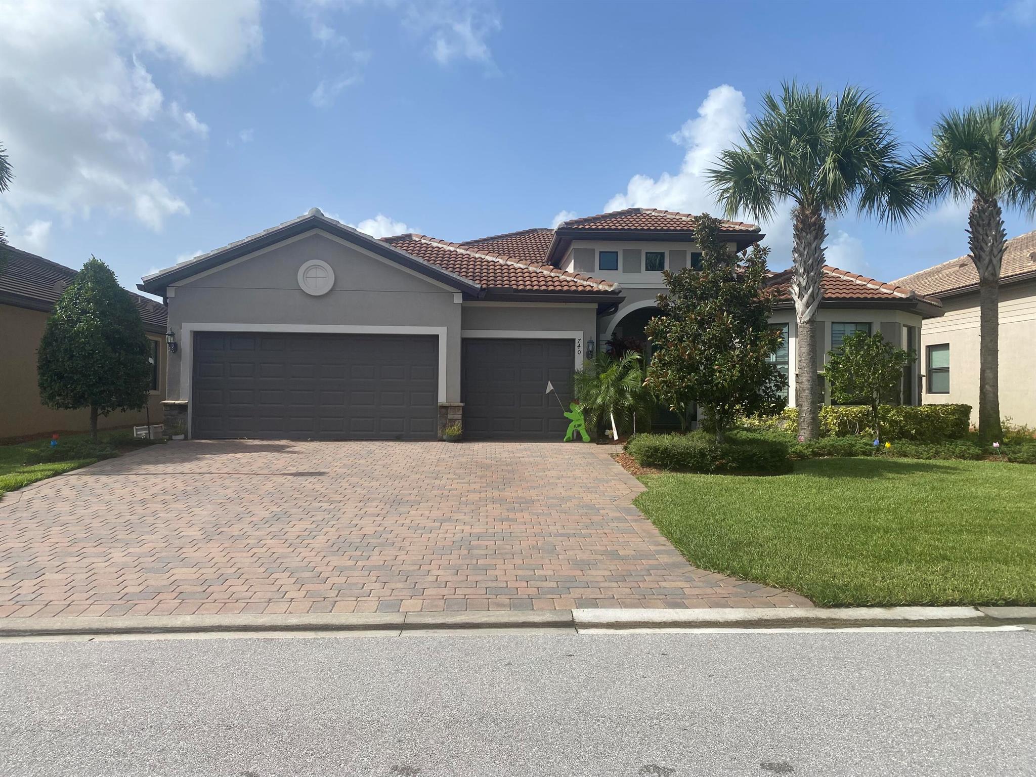 Step into elegance and comfort in this beautifully maintained 3-bedroom, 3-bathroom+Den, 3 car garage, Pinnacle Model home located in the desirable Veranda Gardens Community. Built in 2019, this 2,488 sq ft residence offers spacious living with thoughtful upgrades including crown molding, upgraded corner sliding glass doors that expand your living space to the outdoors, and a spa-like owner's suite with glass shower doors and a generous walk-in closet. The open-concept layout is perfect for entertaining, with abundant natural light and quality finishes throughout. Tile and carpet flooring, stucco exterior, and an attached garage add functionality and comfort.